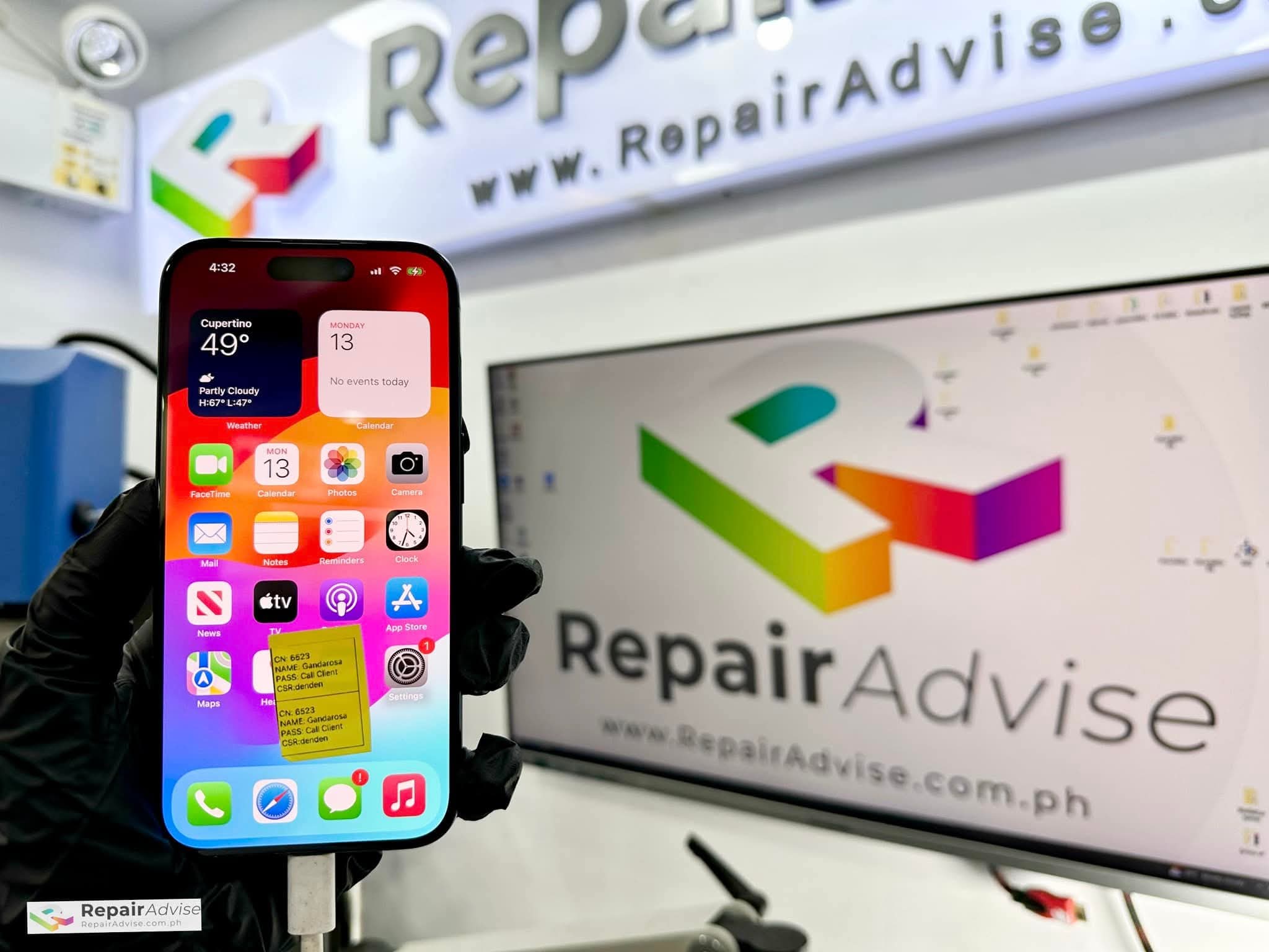 Close-up view of iPhone 15 repair logic board during disassembly